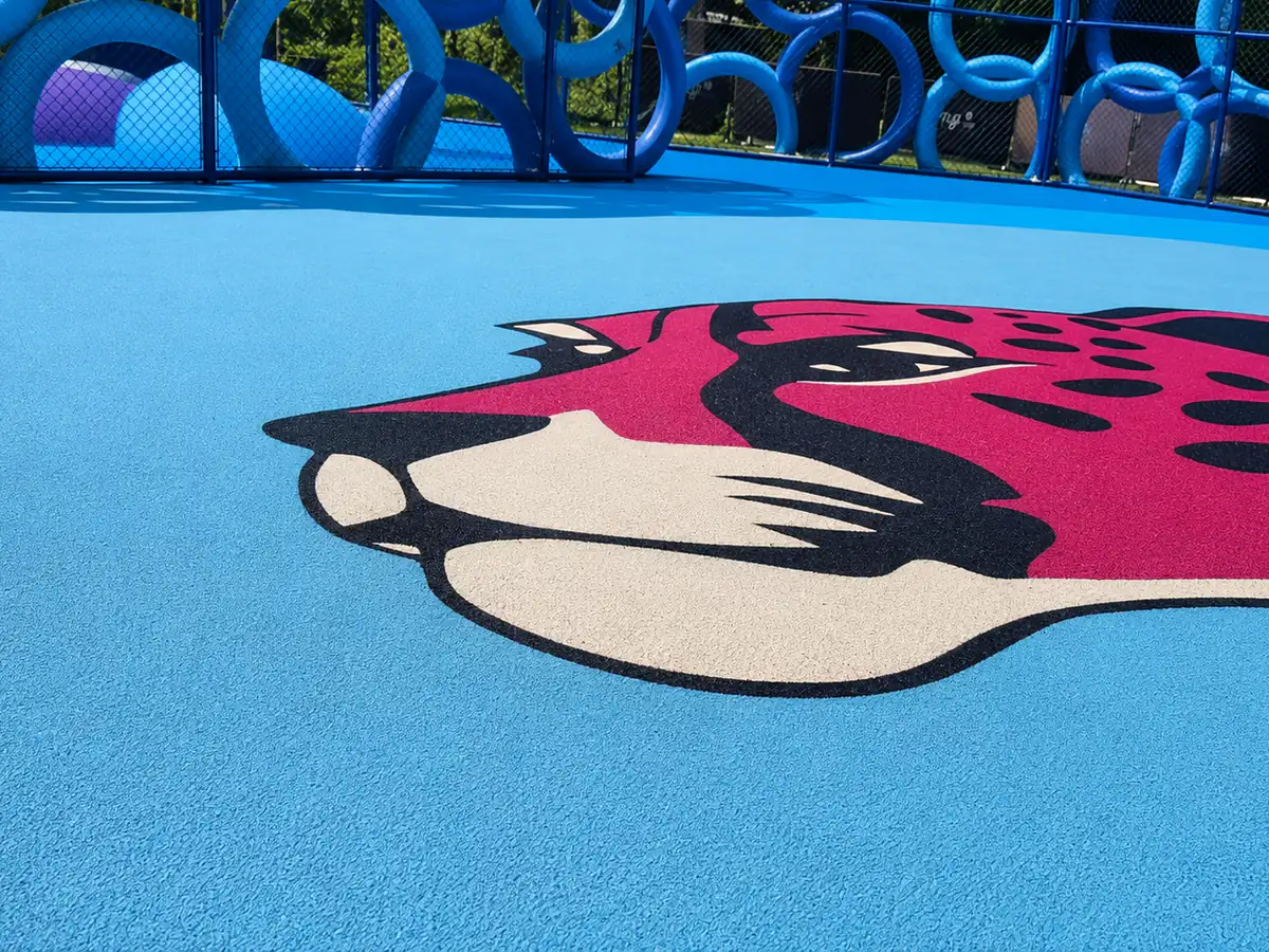 EPDM rubber flooring close-up with a red leopard graphic in a playground