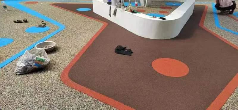 Wet pour EPDM rubber flooring installation using PU binder