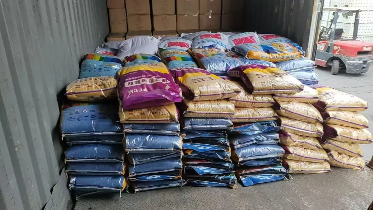 Color-coded EPDM granule bags organized in the packaging area
